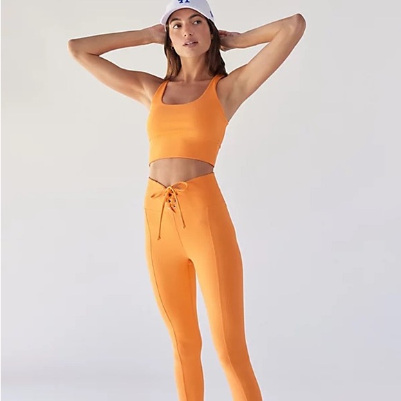 Year Of Ours Ribbed Football Lace Up Leggings in Melon/Orange - Picture 1 of 10